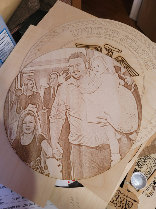 Your picture engraved on wood.  These are custom made from you picture.  They are 7"or 9" in diameter.  Come with Easel stand.